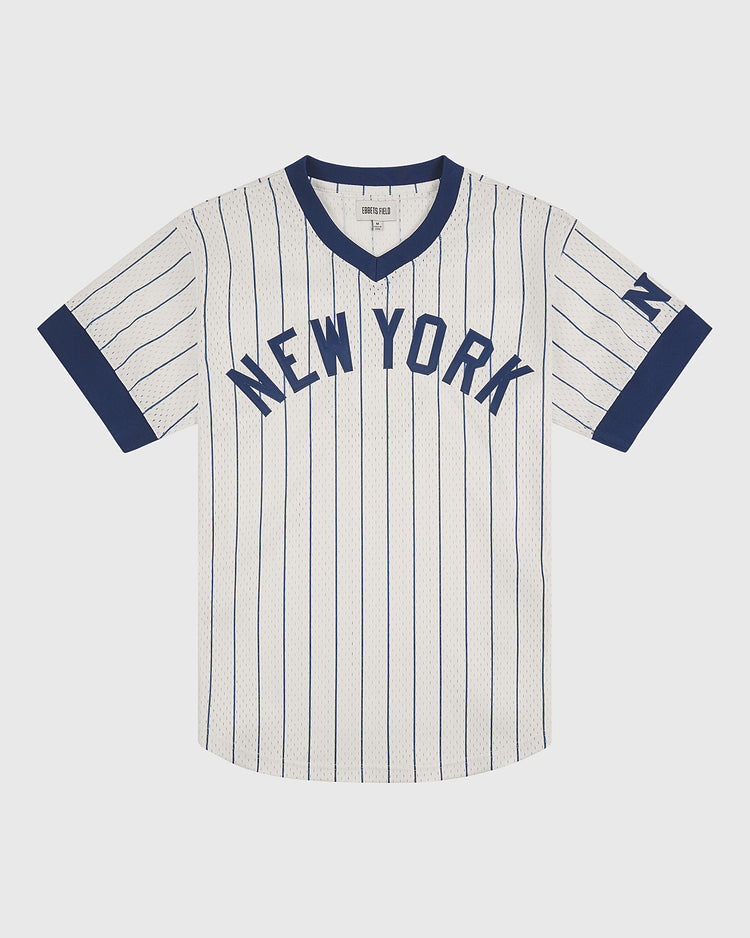 The Ebbets Field NY Black Yankees V-Neck Mesh Jersey features a white, short-sleeved design with navy blue pinstripes, bold “NEW YORK” lettering on the front, a navy blue collar and cuffs, and an N on the left sleeve—capturing the classic vintage style of the Negro National League’s NY Black Yankees.