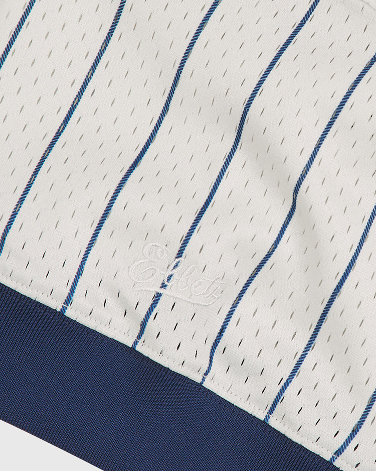 Close-up of the NY Black Yankees V-Neck Mesh Jersey by Ebbets Field, featuring white mesh fabric with thin blue vertical stripes, a ribbed navy hem, and subtle Ebbets embroidery—a detail reminiscent of the iconic Negro National League jerseys.