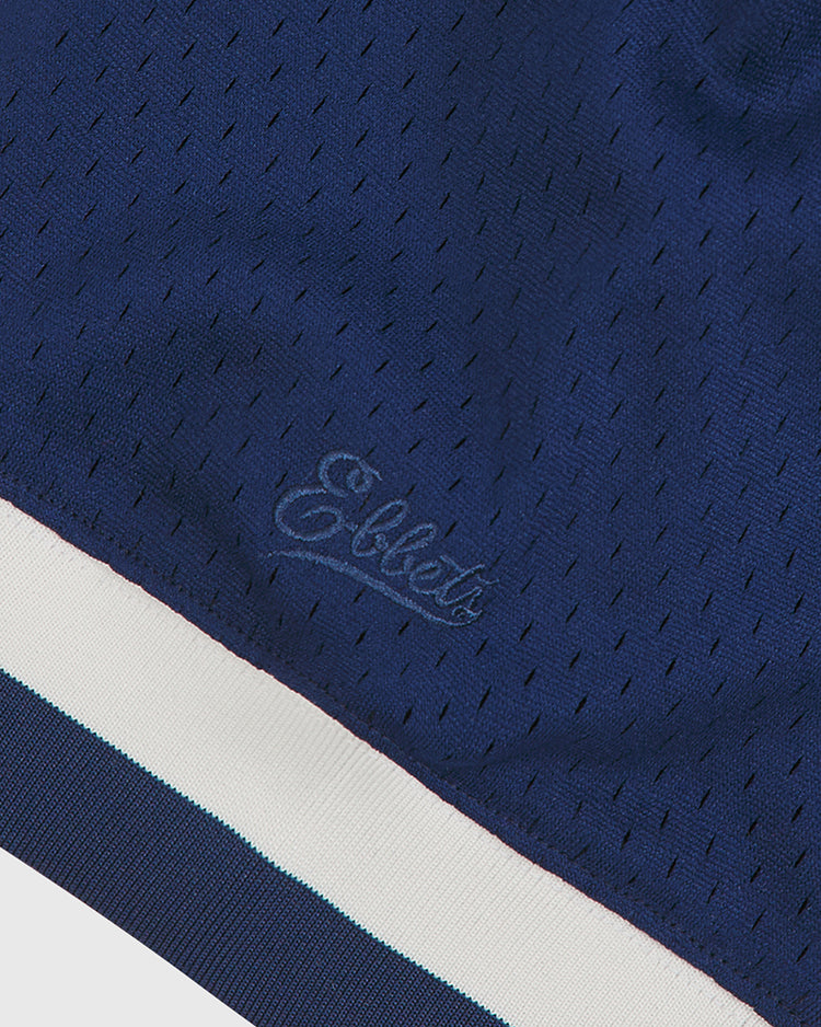 Close-up of navy blue mesh fabric from the Ebbets Field NY Black Yankees V-Neck Mesh Jersey, featuring “Ellet” embroidered across the front and finished with a white and light blue striped trim along the bottom—evoking classic styles from the Negro National League era.
