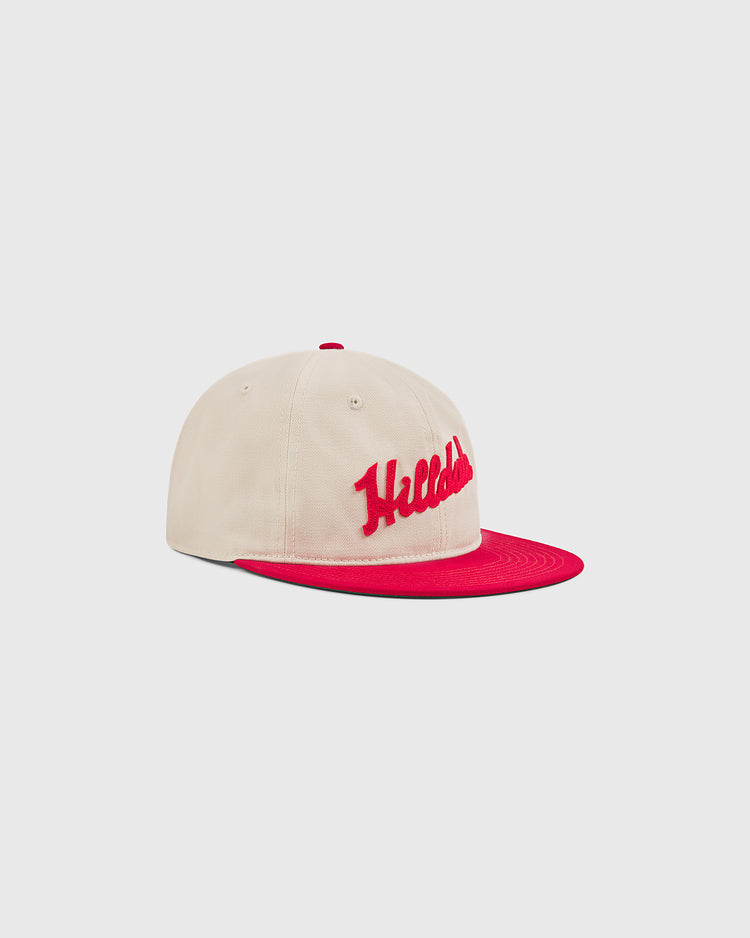 The Ebbets Field Hilldale Athletic Club 1924 Cotton Twill Ballcap features a beige cotton twill design with a red brim and red embroidered script on the front, inspired by a classic Negro League hat, and is displayed against a plain white background.