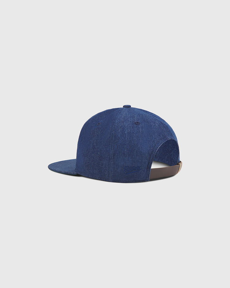 The Ebbets Field Kansas City Katz Indigo Cotton Denim Ballcap is displayed from the back against a plain light grey background. Inspired by the classic Kansas City Katz style, this cap features an adjustable strap and a curved brim.