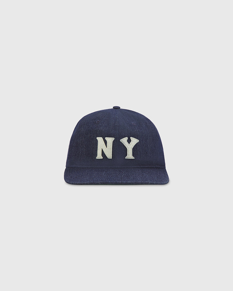 An Ebbets Field New York Black Yankees Indigo Cotton Denim Ballcap with bold white NY lettering on the front, shown against a plain light gray background.