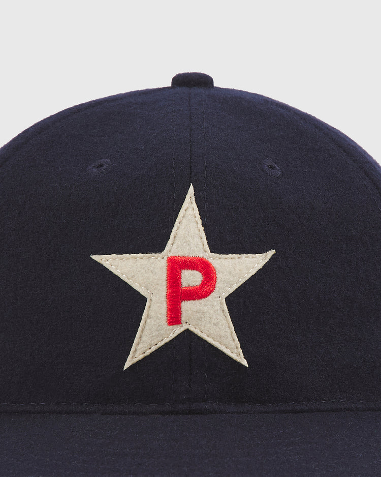 The Ebbets Field Philadelphia Stars 1934 Authentic Wool Ballcap is a navy wool cap featuring a white star patch with a red “P” at the center on the front—a classic design inspired by the original 1934 Philadelphia Stars Negro League ballcap.