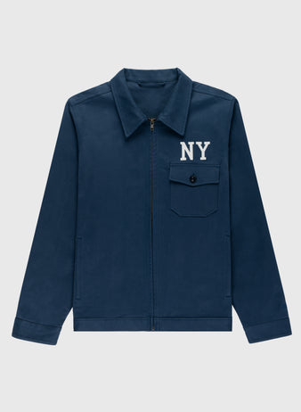 The Ebbets Field Cotton Grounds Crew Jacket by Ebbets Field Flannels is a navy blue cotton jacket with a zip front, pointed collar, buttoned chest pocket, and white NY lettering—ideal for classic spring style.