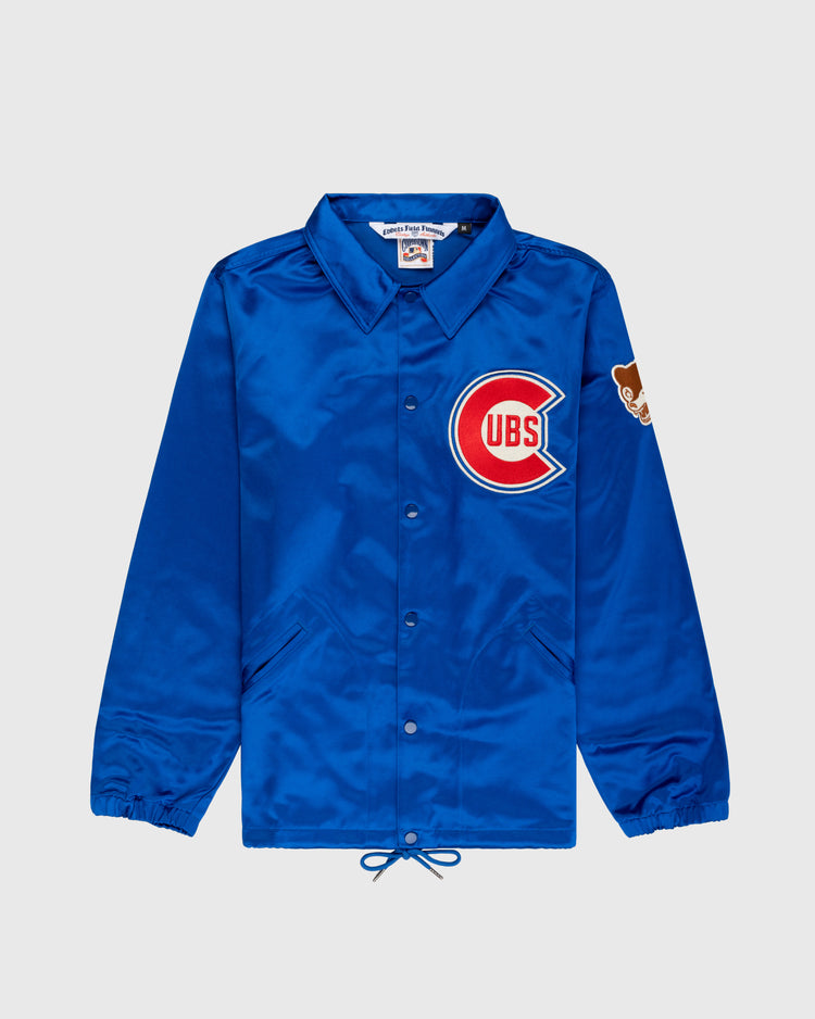The EFF Chicago Cubs 1946 Satin Windbreaker Jacket features blue satin, a large Cubs logo on the left chest, bear patch on the sleeve, collar, elastic cuffs, front pockets, and a drawstring hem.