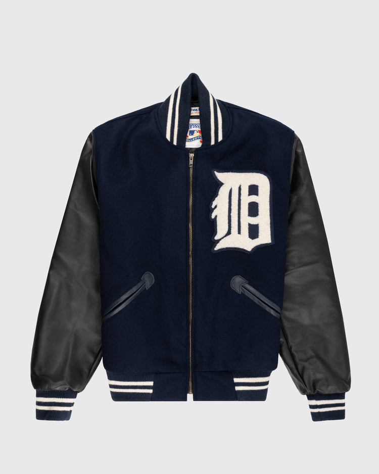 The EFF Detroit Tigers 1955 Authentic Wool & Leather Varsity Jacket features navy wool, black leather sleeves, striped ribbed trim, a front zipper, and a large white D patch—a replica worn by Al Kaline.