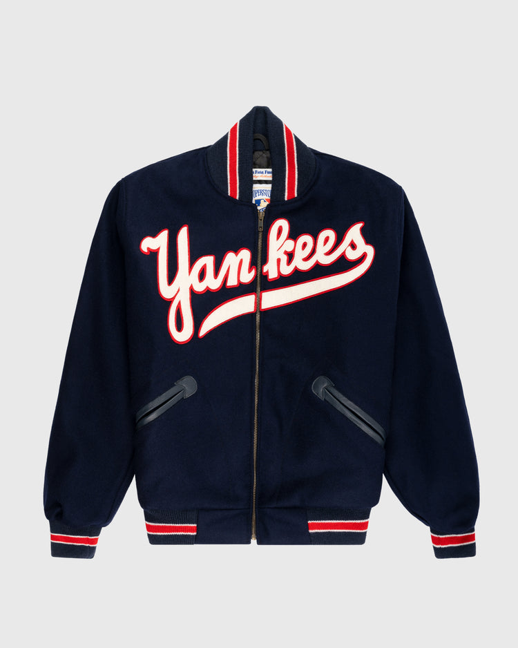 The EFF New York Yankees 1947 Authentic All Wool Varsity Jacket in navy features bold white and red Yankees script, striped trim, two slanted pockets—a classic tribute to the 1947 World Champions.