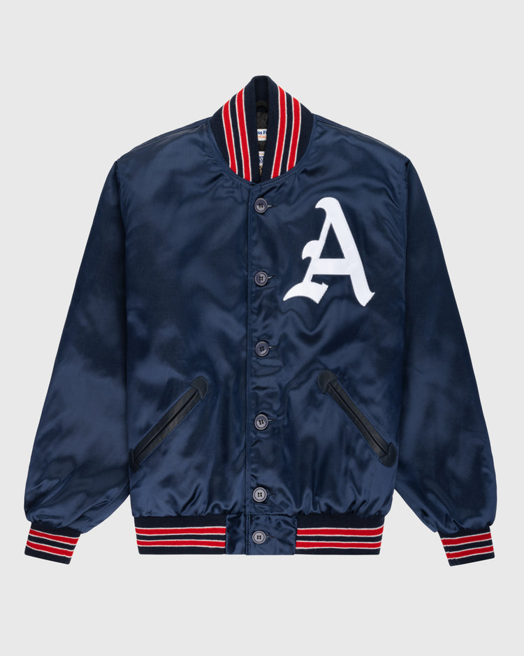 The EFF Kansas City Athletics 1960 Authentic All Satin Varsity Jacket features navy satin, black buttons, red and white striped trim, a large white A patch on the chest, and black-trimmed pockets—faithful to the vintage 1960 KC Athletics style.