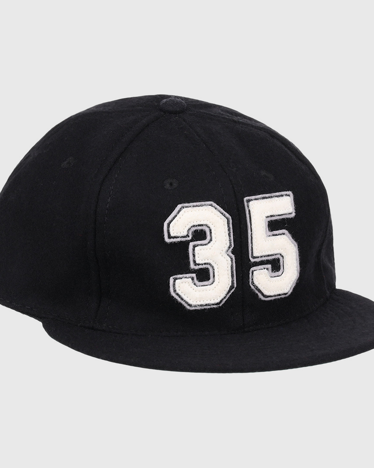 The Frank Thomas Signature Series Ballcap by Ebbets Field Flannels is a black vintage wool cap with a bold white 35 on the front—ideal for National Baseball Hall of Fame fans.
