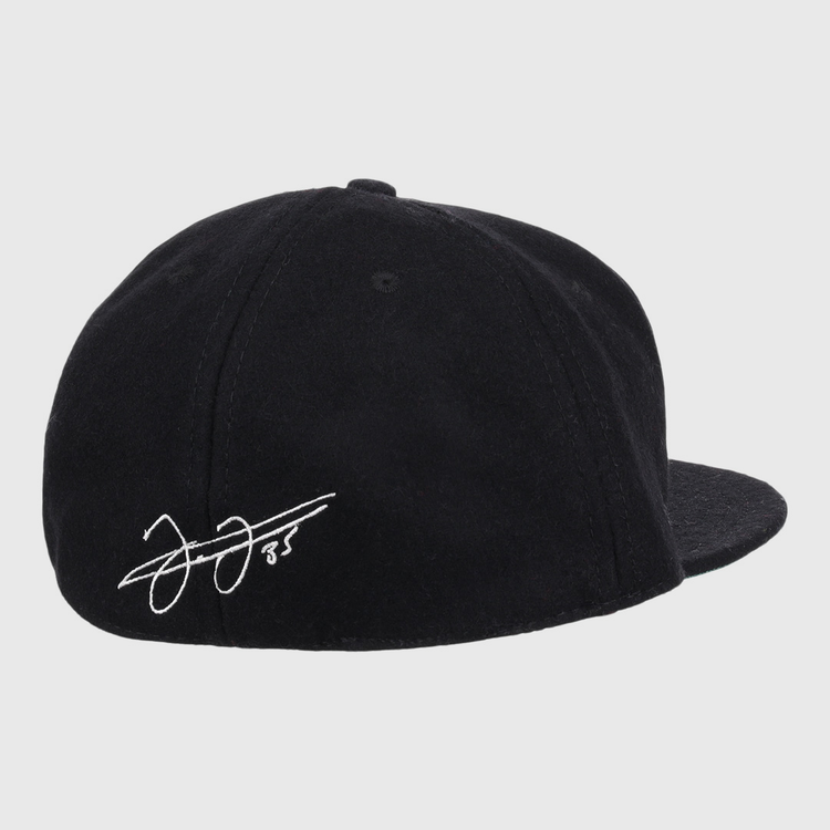 The Frank Thomas Signature Series Ballcap by Ebbets Field Flannels is a black vintage wool cap, seen from the back, with a white Frank Thomas signature and the number 85 on the left side above the brim.