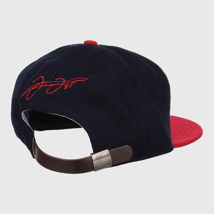 The Frank Thomas Signature Series Ballcap - Navy by Ebbets Field Flannels is a navy and red cap inspired by vintage Chicago White Sox styles, with a brown adjustable strap, metallic clasp, and red signature embroidery on the rear.