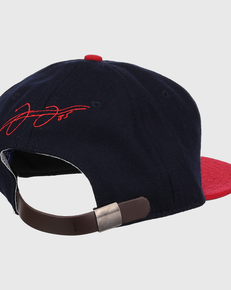 The Frank Thomas Signature Series Ballcap - Navy by Ebbets Field Flannels is a navy and red cap inspired by vintage Chicago White Sox styles, with a brown adjustable strap, metallic clasp, and red signature embroidery on the rear.