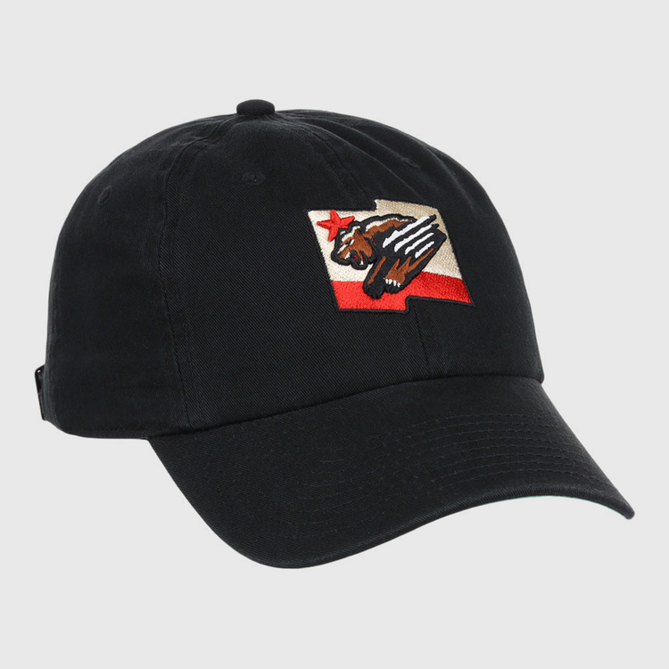 The Fresno Grizzlies MiLB Dad Ballcap by Ebbets Field is a black cap featuring a patch with a stylized bear, red star, and red stripe, inspired by the California state flag design.