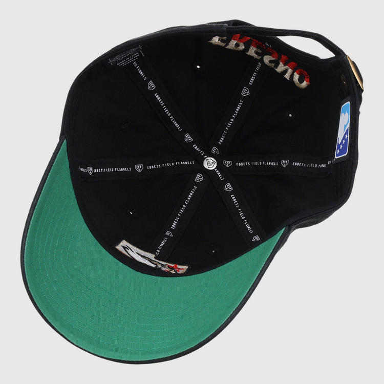 The underside of the Fresno Grizzlies MiLB Dad Ballcap by Ebbets Field features a green brim, visible inner stitching, branded black fabric tape with white logos and text, tags, labels, and a small patch sewn near the back.
