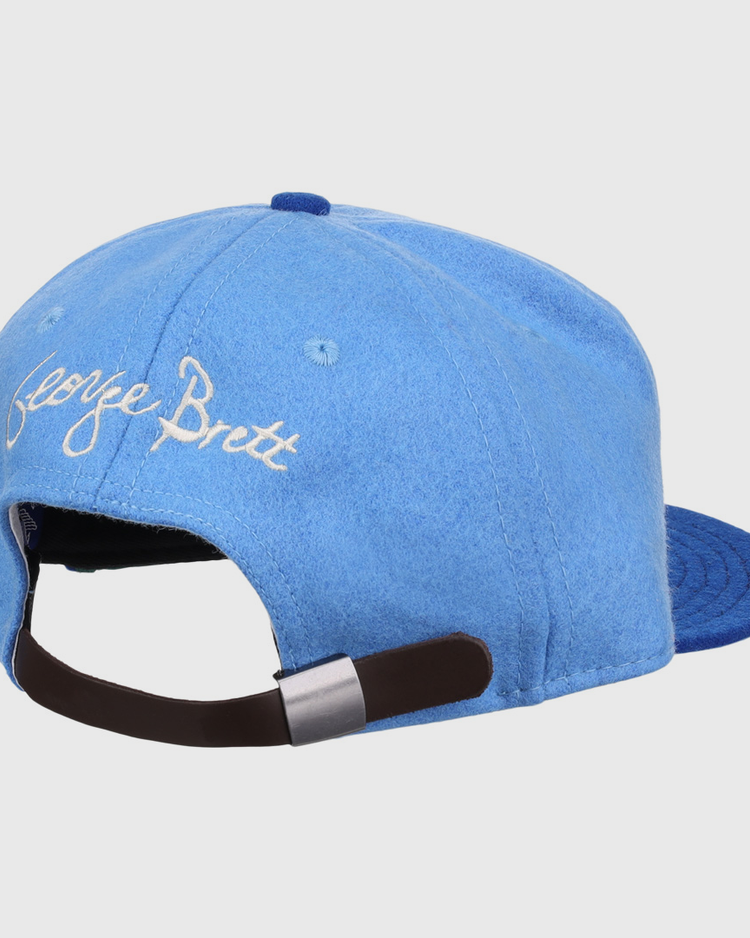 The George Brett Signature Series Ballcap by Ebbets Field Flannels is a light blue vintage wool hat with white embroidered George Brett on the back and an adjustable strap—honoring the National Baseball Hall of Fame legend.