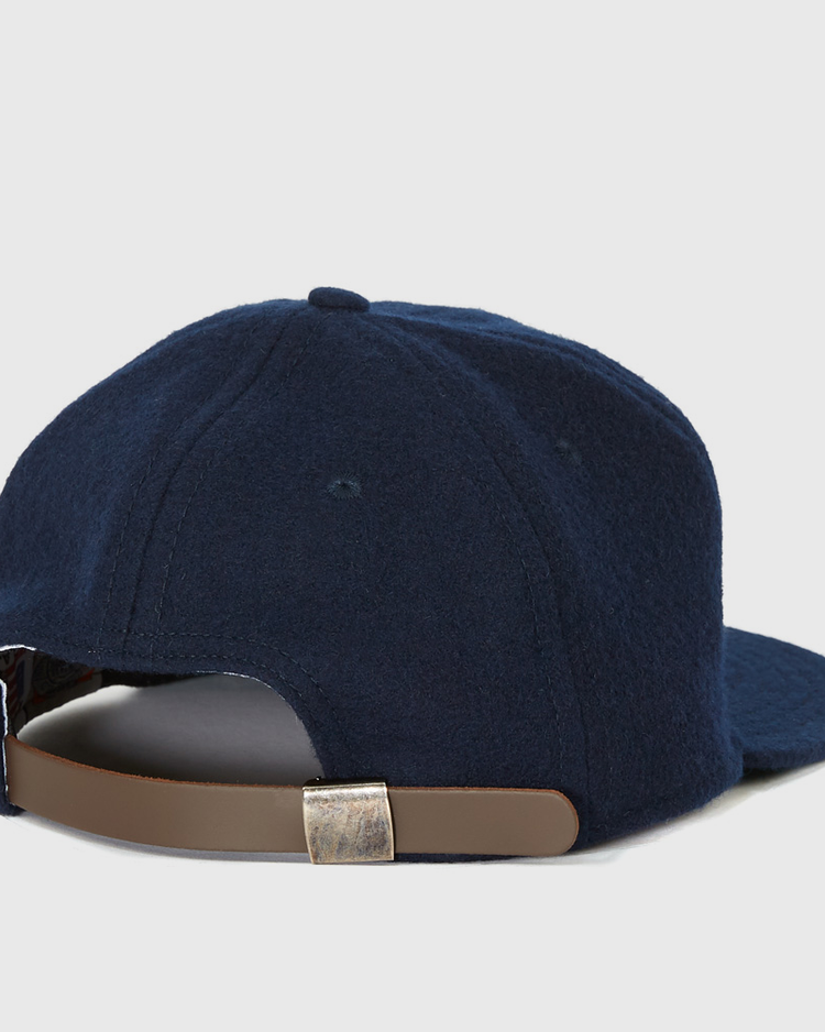 The EFF Gonzaga University 1971 Vintage Ballcap, shown from the back in navy blue, features a brown adjustable strap with a silver buckle—an authentic reproduction ideal for any Gonzaga ballcap collection.