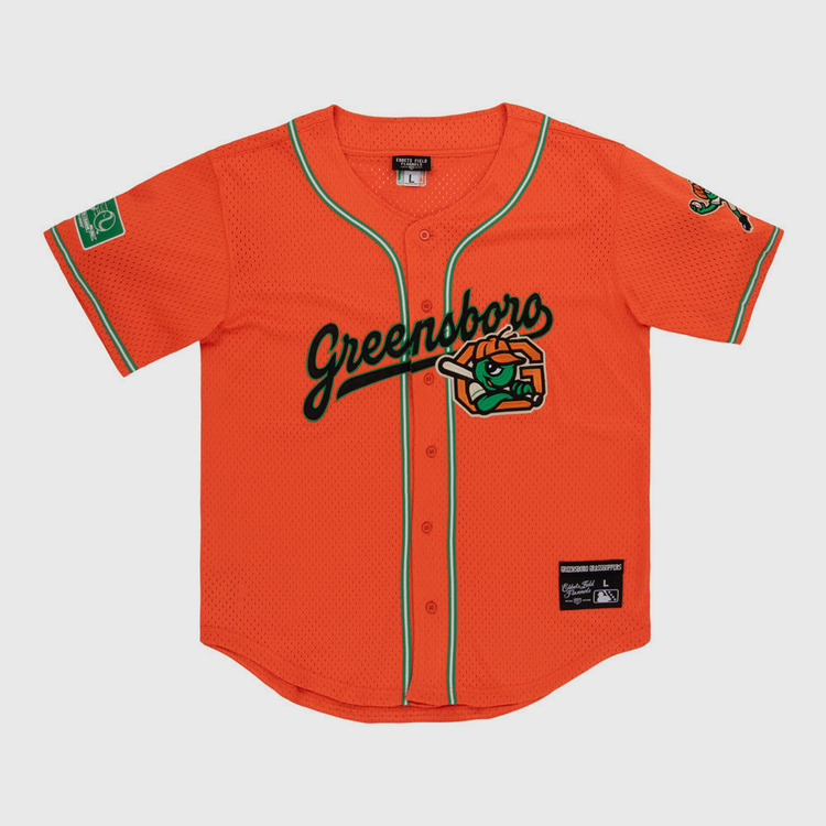 The Ebbets Field Greensboro Grasshoppers MiLB Button Down Jersey features bright orange fabric with green trim, 