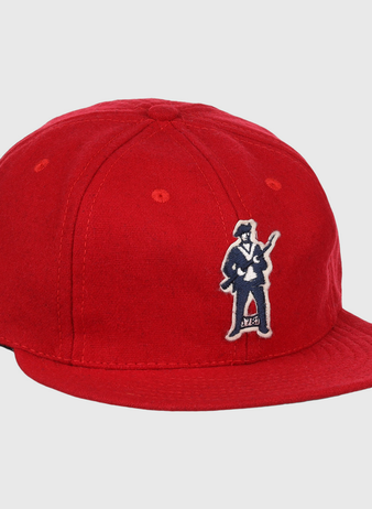 The EFF Greensboro Patriots 1922 Vintage Ballcap is a bright red hat with an embroidered figure in a suit holding a guitar on the front left side.