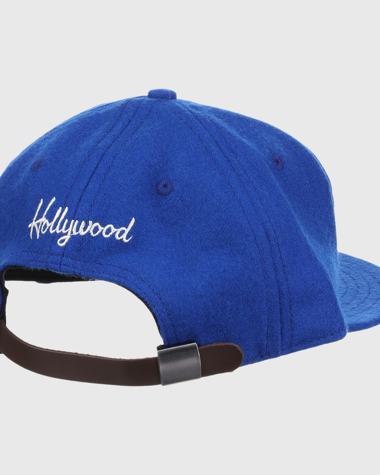 The EFF Hollywood Stars Letterhead Wool Vintage Ballcap features Hollywood embroidered in white on the back, an adjustable brown strap with metal buckle, and classic Pacific Coast League-inspired style.