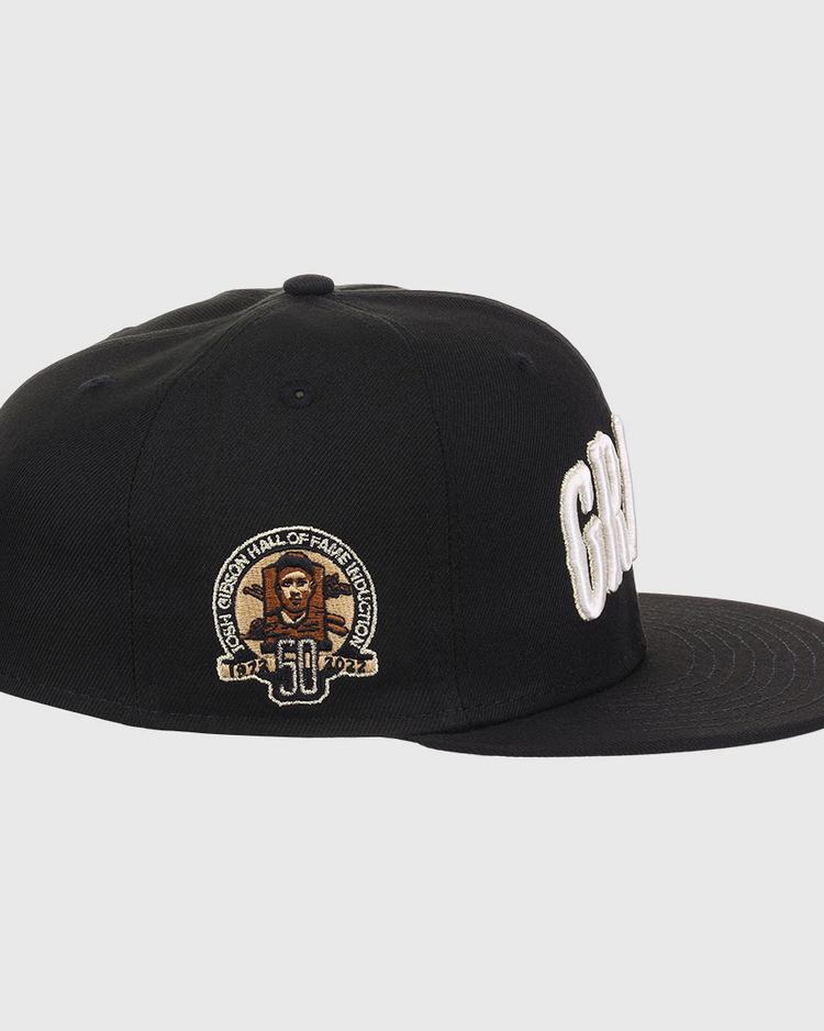 The EFF Homestead Grays Josh Gibson Fitted Ballcap in black features white embroidered lettering, a side patch with Josh Gibson’s portrait, “50,” and “Hall of Fame Induction” in gold and white, making it a true limited edition hat.