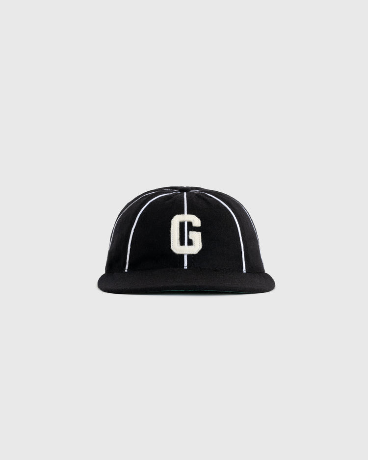 The EFF Homestead Grays 1939 Authentic Wool 8-Panel Ballcap features a black design with thin white stripes and a large white “G” on the front, displayed against a plain gray background.