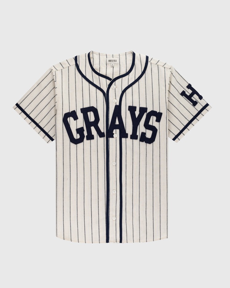 The Ebbets Field Flannels Homestead Grays 1939 Authentic Wool Home Baseball Jersey features cream wool, navy pinstripes, CRAYS on the front, and an H on the sleeve—faithfully replicating the legendary 1939 Grays look.