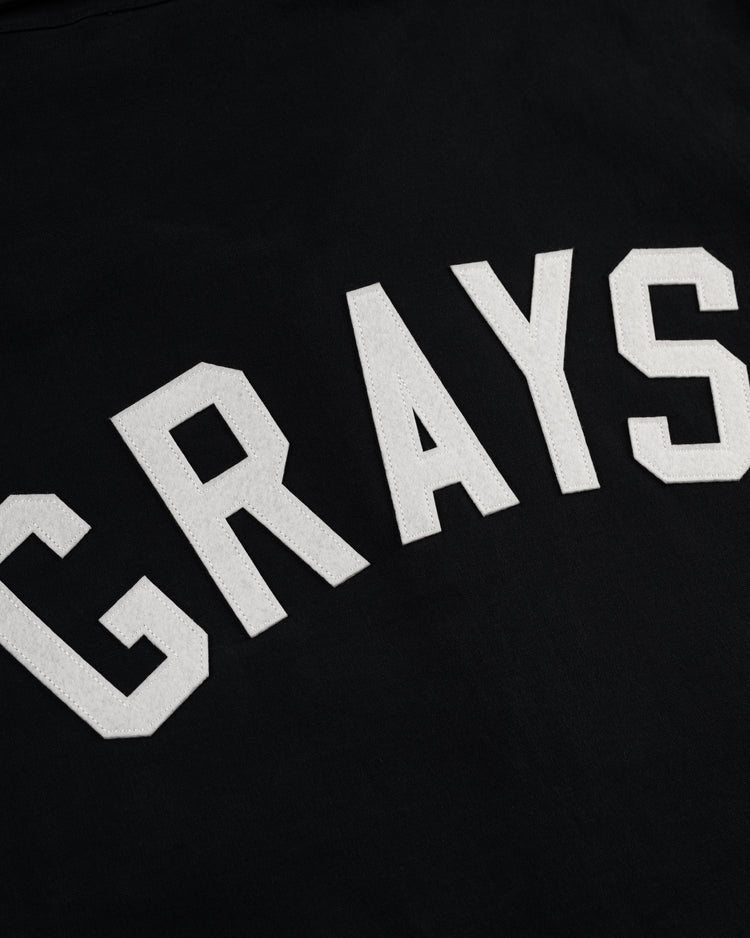 White, bold, capitalized letters spelling GRAYS appear on the Homestead Grays Cotton Grounds Crew Jacket by Ebbets Field Flannels, honoring the legacy of the historic Negro Leagues Baseball team.