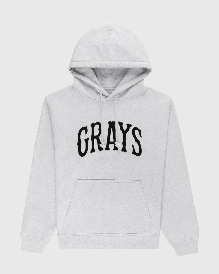 The Ebbets Field Flannels Homestead Grays Heavyweight Cotton Terry Pullover Hoodie features light gray fabric, a front pocket, and bold black GRAYS lettering—honoring the legendary team and Negro Leagues Baseball Museum history.