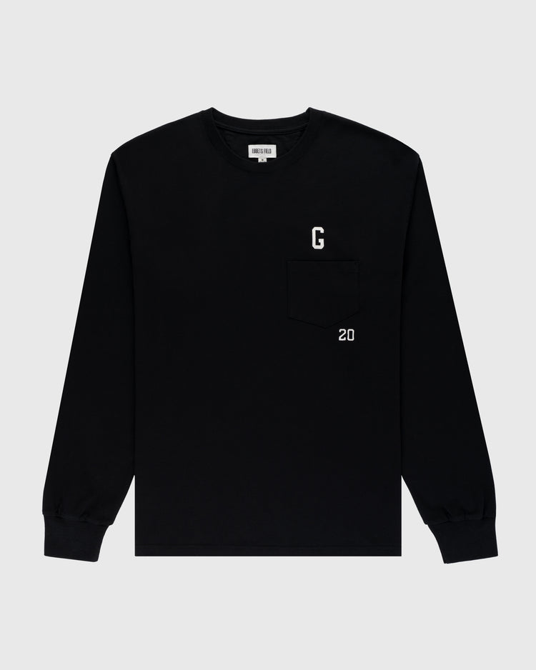 The Ebbets Field Flannels Homestead Grays Embroidered G Long Sleeve Pocket Tee is a black shirt with ribbed cuffs, crew neck, and chest pocket, featuring a white G above and 20 below as a tribute to Josh Gibson and the Homestead Grays.