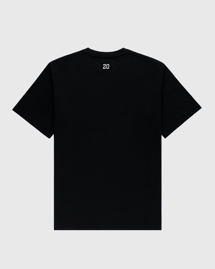 The Ebbets Field Flannels Homestead Grays Embroidered G Short Sleeve Tee is a plain black t-shirt seen from the back, featuring a small white embroidered G logo near the collar, set against a light gray background.