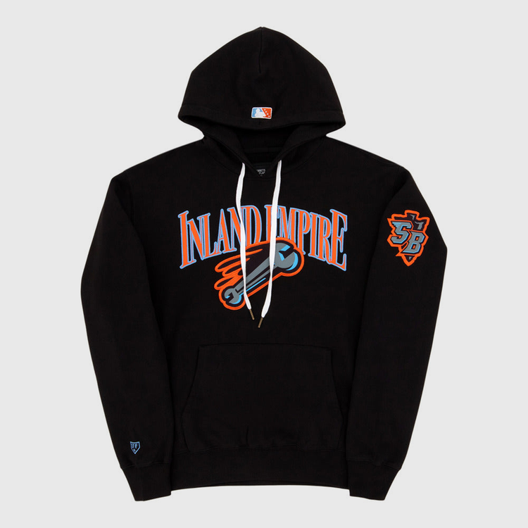 The Ebbets Field Inland Empire 66Ers MiLB Cotton Hooded Sweatshirt is a black hoodie with bold blue and orange INLAND EMPIRE text, a baseball bat graphic on the chest, SB logo patch on the left sleeve, and a small logo near the left cuff.