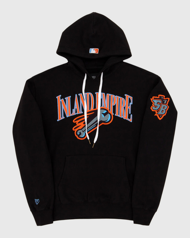 The Ebbets Field Inland Empire 66Ers MiLB Cotton Hooded Sweatshirt is a black hoodie with bold blue and orange INLAND EMPIRE text, a baseball bat graphic on the chest, SB logo patch on the left sleeve, and a small logo near the left cuff.