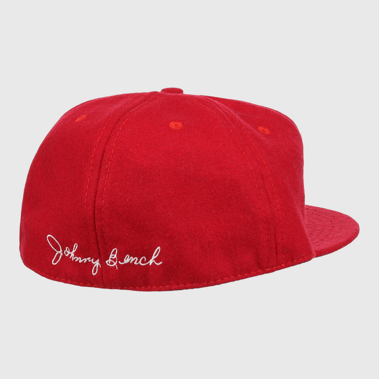 The Johnny Bench Signature Series Ballcap by Ebbets Field Flannels is a bright red vintage wool cap with a flat brim and white cursive Johnny Bench signature embroidered on the back left, featuring no front logos.