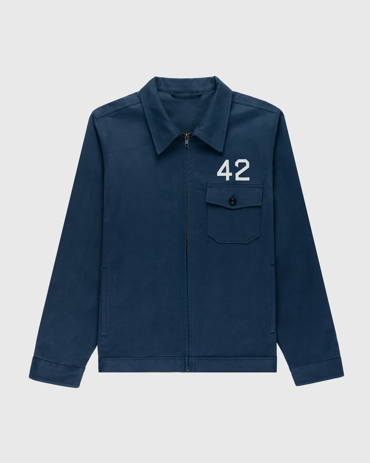 The Ebbets Field Jackie Robinson Cotton Grounds Crew Jacket features a navy blue design, classic collar, front zipper, left chest buttoned pocket with white 42 above it, and long sleeves for a timeless baseball jacket style.
