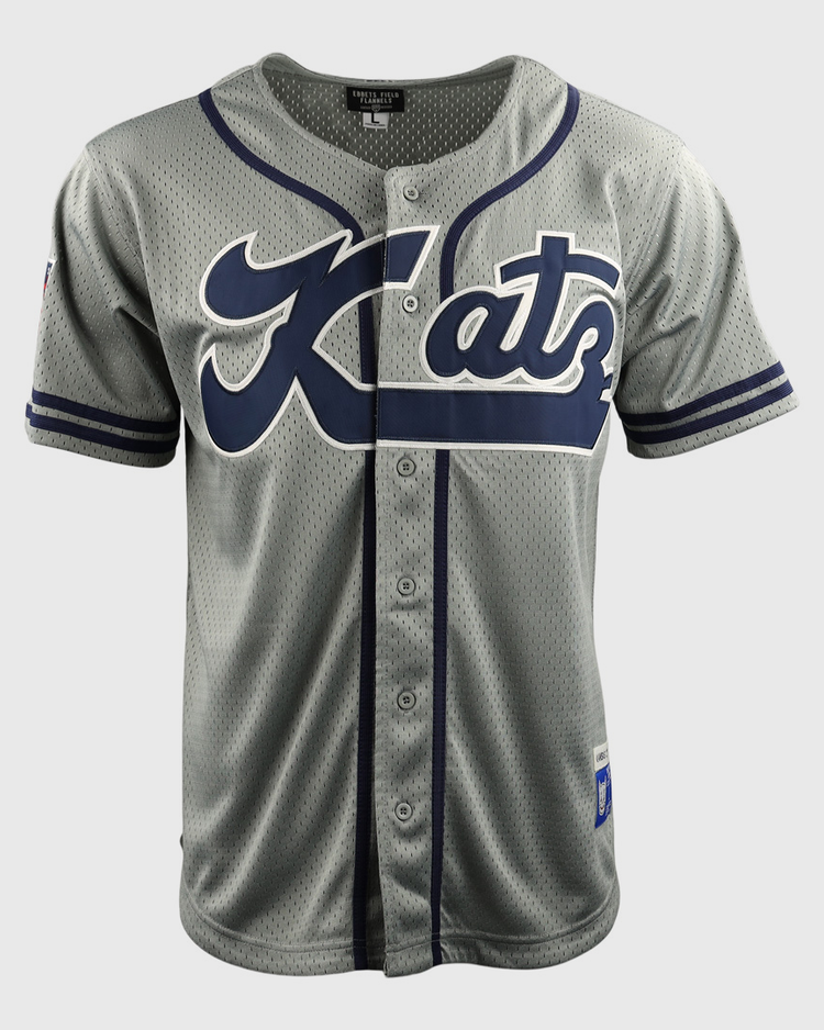 The EFF Kansas City Katz DNA Replica Button-Up Mesh Jersey features gray fabric with navy accents, Katz in large script on the front—a tribute to Katz Drugstore and the Ban Johnson Baseball League. It has front buttons and short sleeves.