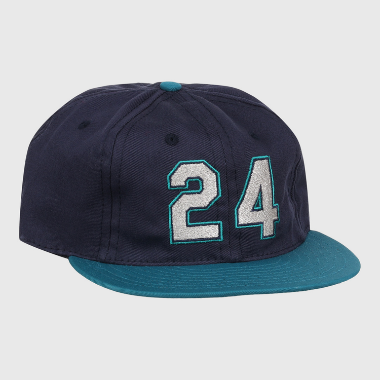 The Ebbets Field Flannels Ken Griffey Jr. 1995 Signature Series Ballcap is navy blue with a teal brim and button, and features the number 24 stitched in white and teal on the front.
