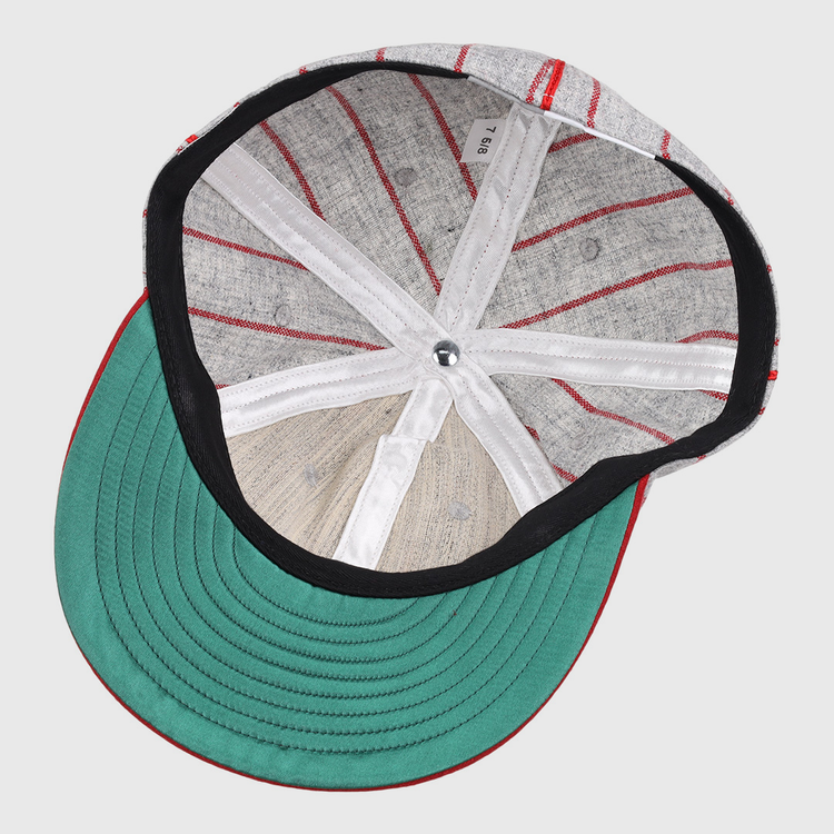 The image displays the inside of an EFF Knoxville Giants 1920 Vintage Ballcap, featuring a green brim, black lining, white bands, visible stitching, and a silver top button true to the original 1920 design.