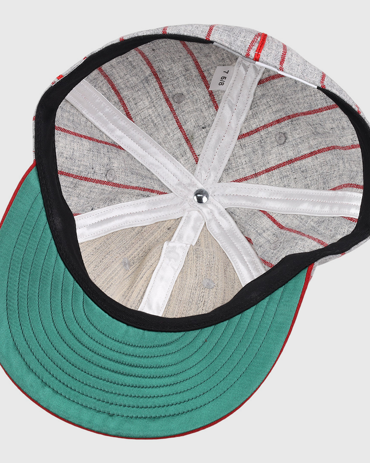 The image displays the inside of an EFF Knoxville Giants 1920 Vintage Ballcap, featuring a green brim, black lining, white bands, visible stitching, and a silver top button true to the original 1920 design.
