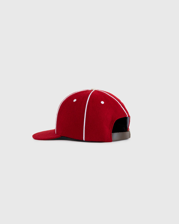 The EFF Kansas City Monarchs 1949 Authentic Wool Ballcap features red wool, white piping, and an adjustable black strap, shown on a plain light gray background.