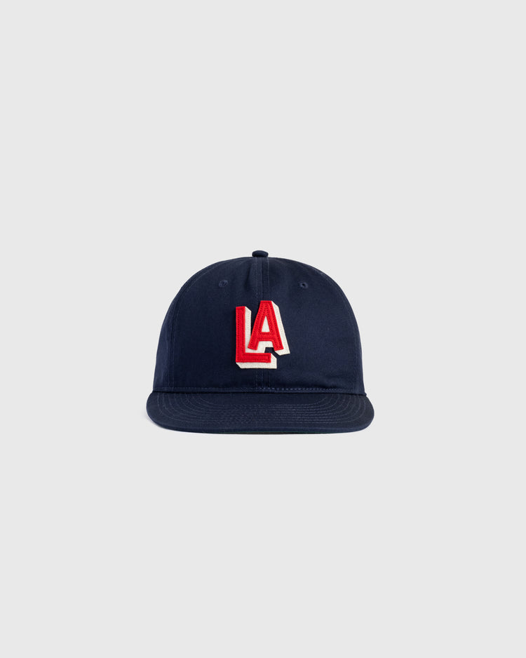 The Ebbets Field Los Angeles Angels (PCL) 1942 Logo Cotton Twill Ballcap in navy blue features a red and white LA logo embroidered on the front, capturing the authentic style of classic PCL baseball hats.