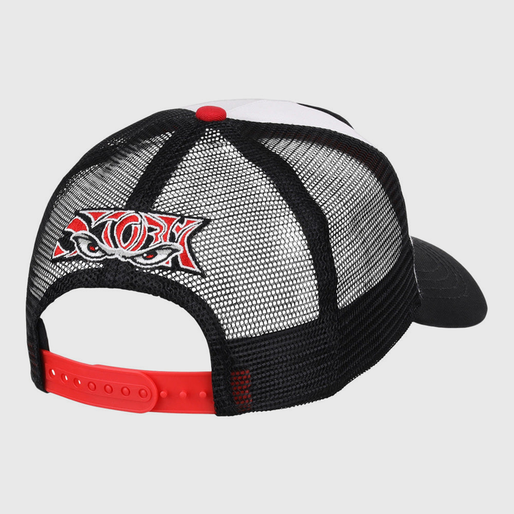 The Lake Elsinore Storm MiLB Trucker Ballcap by Ebbets Field is a black mesh hat with a red adjustable strap and a colorful embroidered patch of stylized eyes and bold lettering on the back. The front and bill are partially visible.