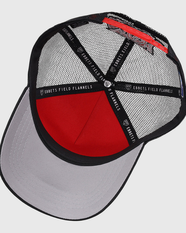 The Lake Elsinore Storm MiLB Trucker Ballcap by Ebbets Field features a red and black mesh crown, gray curved brim, black interior bands with EBBETS FIELD FLANNELS labeling, and an adjustable back strap.