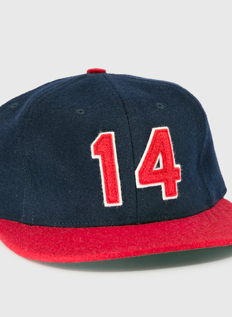 The Ebbets Field Flannels Larry Doby Signature Series Ballcap is a limited edition navy blue baseball cap with a red brim and the number 14 in bold red and white on the front.