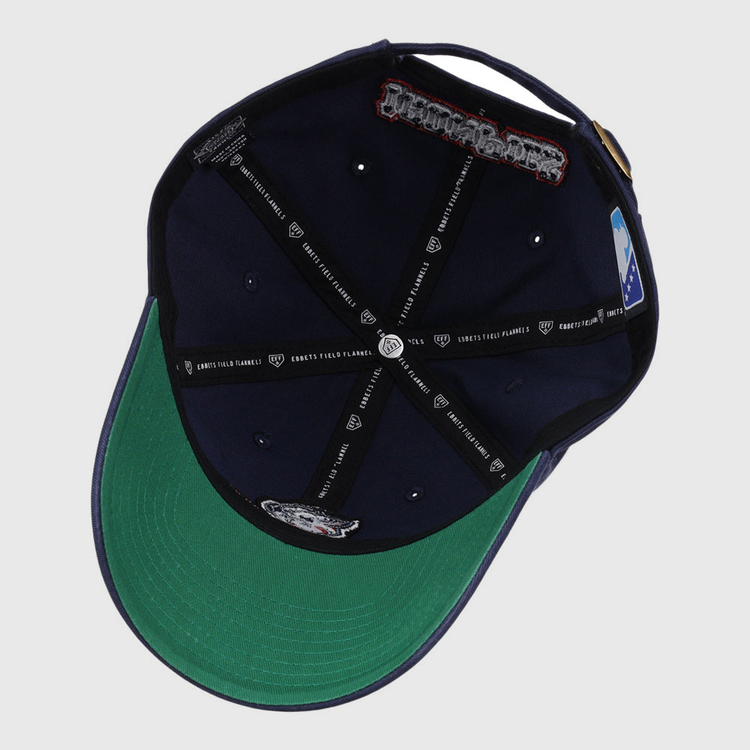 The underside of the Lehigh Valley Ironpigs MiLB Dad Ballcap by Ebbets Field features a green brim, black and white branded bands, sewn patches, and an official MLB logo on the inner panel.