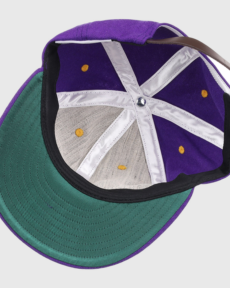 The EFF Louisiana State University Vintage Ballcap has a green underside brim, white interior seams, yellow stitching, and an adjustable brown strap—an ideal addition to any LSU Tigers hat collection.
