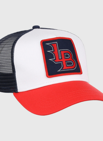 The Ebbets Field Louisville Bats MiLB Trucker Ballcap features a white front, black mesh back, red bill, and a square “LB” patch in red and white on a navy background.