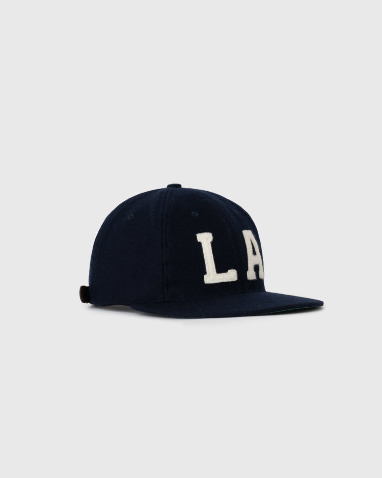 The EFF Los Angeles (PCL) 1949 Authentic Wool Ballcap in navy features large white embroidered LA letters on the front and a flat brim, shown against a plain light gray background.
