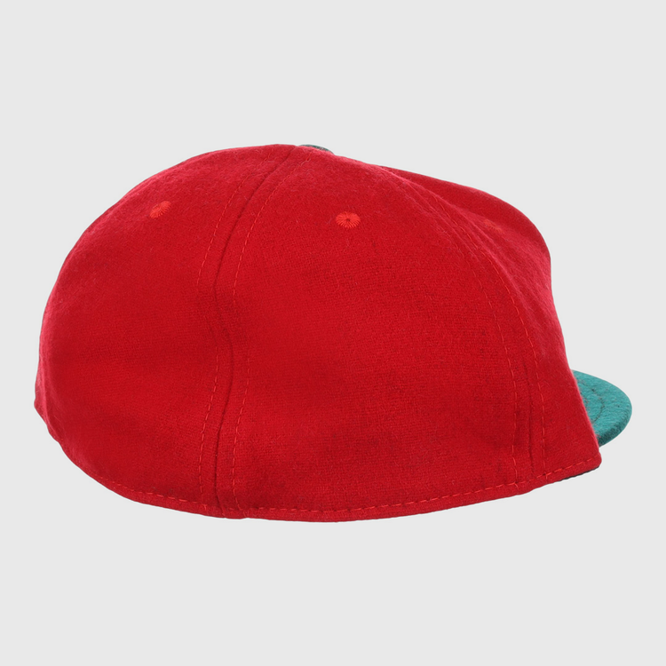 The M&O Cigars 1946 Vintage Ballcap by EFF is a red cap shown from the back, with a teal brim partially visible on the right. Its soft fabric and visible stitching evoke timeless, classic style.