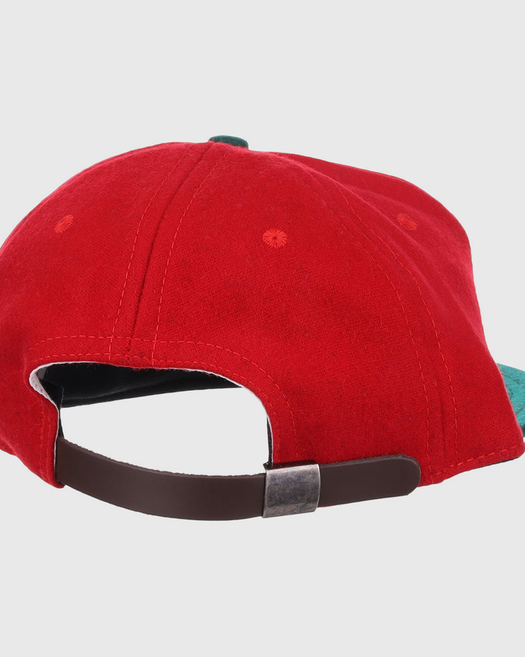 The EFF M&O Cigars 1946 Vintage Ballcap is shown from the back, highlighting its brown adjustable strap with a metallic buckle and a green bill peeking out on the right.