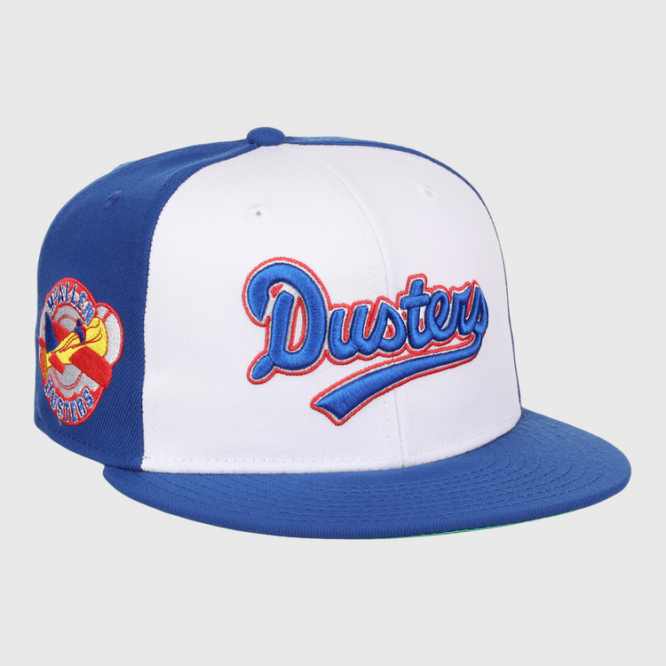 The EFF McAllen Dusters Lone Star Fitted Ballcap features blue and white panels, blue and red McAllen Dusters script embroidery, a winged baseball patch on the side, and a blue brim for classic league style.